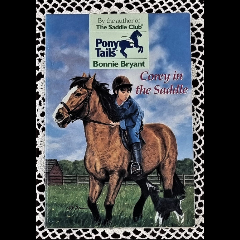 Cover of the book 'Pony Tails: Corey in the Saddle' featuring a young girl on a horse.