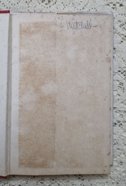 Inside front cover of Scrolls from the Dead Sea by W.H.Allen showing foxing and inscription.