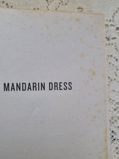 Example of foxing on Red Mandarin Dress by QIU XIAOLONG