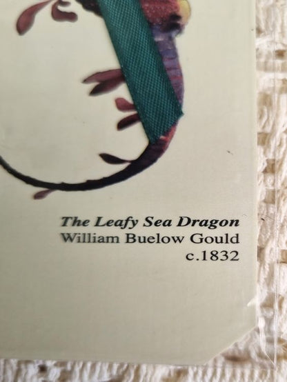 Close-up of caption on bookmark of a sea dragon by William Buelow Gould