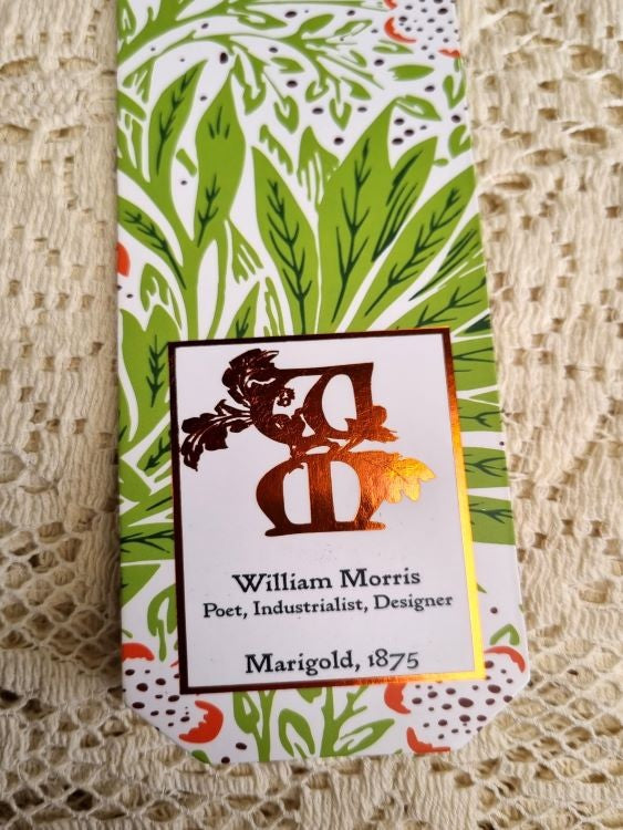 A close up of the text box on a bookmark of William Morris' Marigold design from 1875
