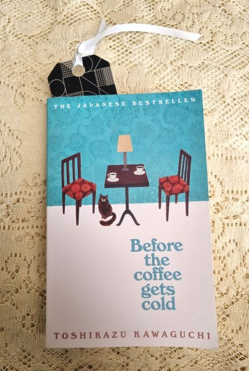 A bookmark of the Art Deco design Silver Ball inside a book