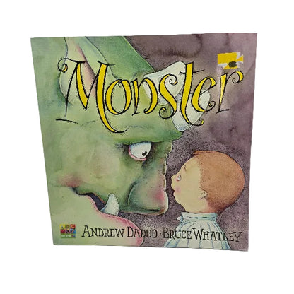 Children's book titled 'Monster' by Andrew Daddo and Bruce Whatley, featuring an illustration of a green monster face and a child on the cover.
