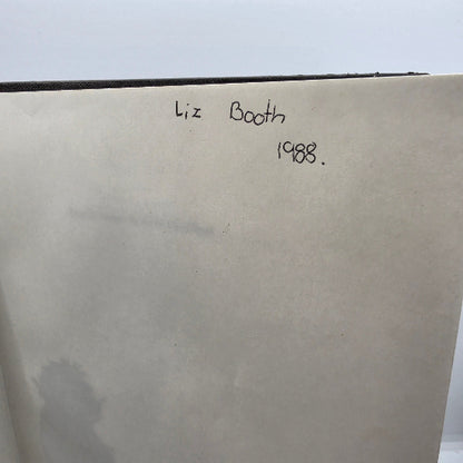A close-up of a handwritten inscription in the book. 