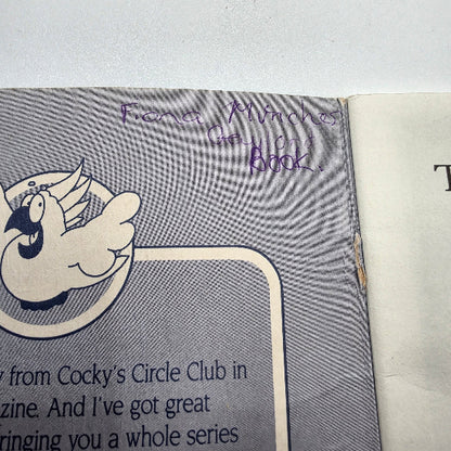 A close-up of a book page with handwriting on it.