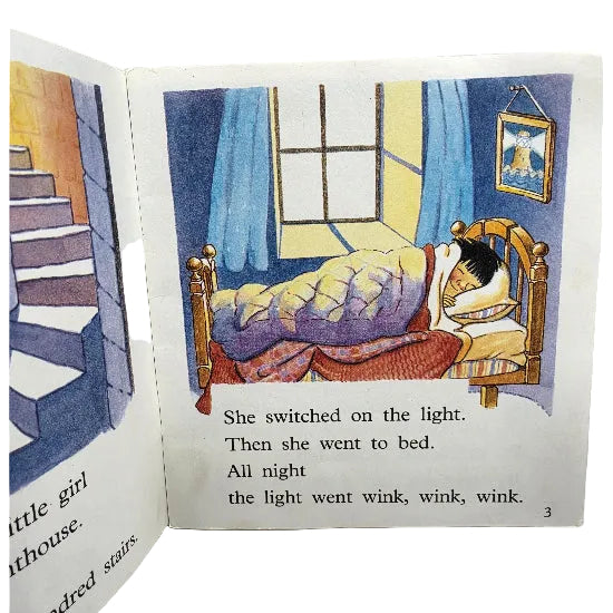 An open children's book showing a illustrated bedroom scene with a child sleeping in bed and printed text below. 