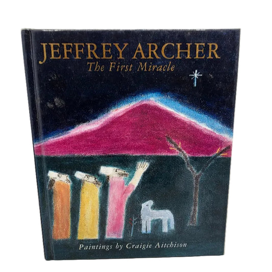 A hardcover book titled 'Jeffrey Archer: The First Miracle' with a dark cover illustration featuring a pink mountain, colourful figures, and a white sheep.