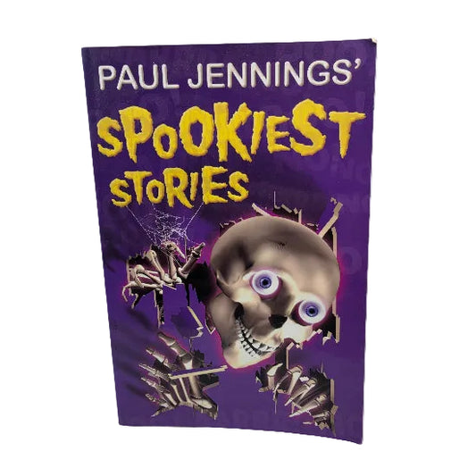 A paperback book titled 'PAUL JENNINGS' Spookiest Stories' by Paul Jennings, featuring a purple cover with a skull, spider, and skeletal hands.