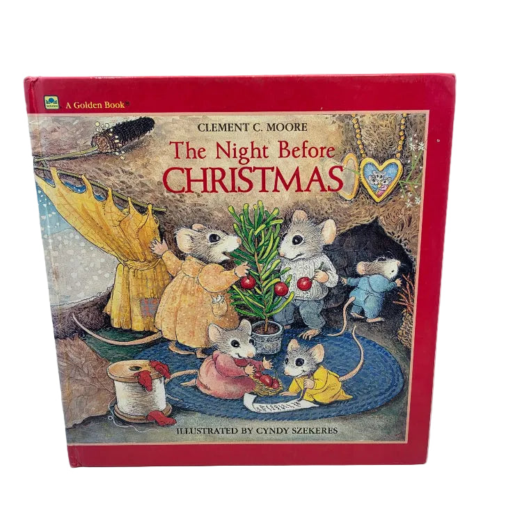 A vintage hardcover children's book titled 'The Night Before Christmas' by Clement C. Moore, illustrated by Cindy Szekeres.