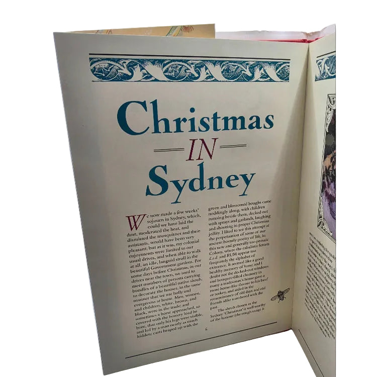 An open book spread showing a printed page titled "Christmas in Sydney" with teal text on an off-white page.