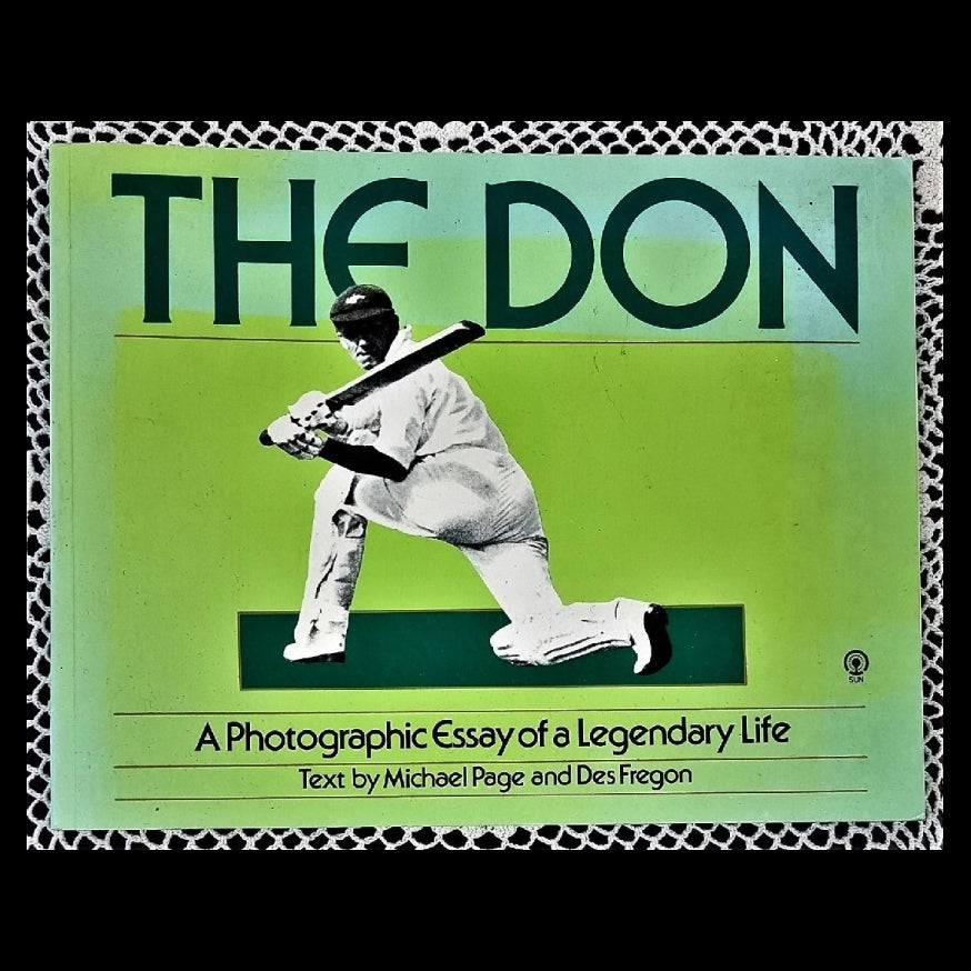 The cover of the book 'The Don' features a black and white image of a man holding a cricket bat, with a green background and the title 'A Photographic Essay of a Legendary Life'.