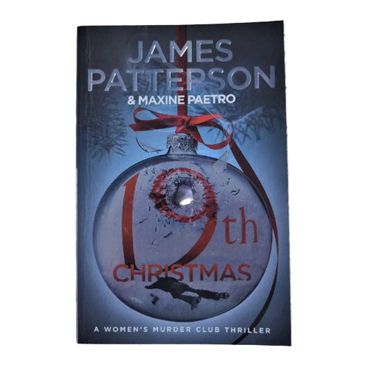Book cover for '19th Christmas' by James Patterson & Maxine Paetro, featuring a dark blue Christmas ornament with a red ribbon and red text.