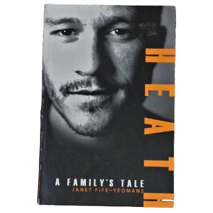 The cover of the book 'Heath: A Family's Tale' features a close-up portrait of Heath Ledger. 
