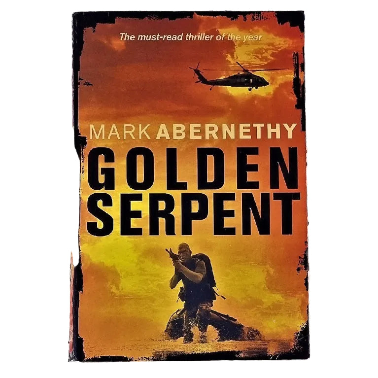 Cover of the book 'Golden Serpent' by Mark Abernethy featuring an armed soldier in front of a boat with a helicopter flying overhead against a dramatic sky background.