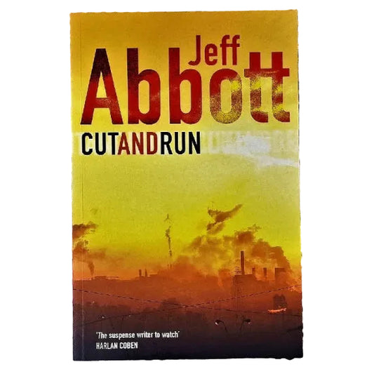 The cover of the book 'Cut And Run' by Jeff Abbott features a yellow and orange sunset with silhouettes of smoke stacks.