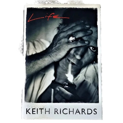 Book cover to Keith Richards 'Life'. Featuring a black and white photograph of a hand covering part of his face. 