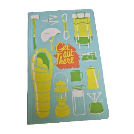 A notebook with a light blue cover featuring retro-style camping illustrations in yellow, green, and orange, including a sleeping bag, lantern, backpack, mug, and the phrase 'Get Out There'. 