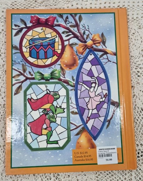 Back cover. Showing three removable Christmas ornaments