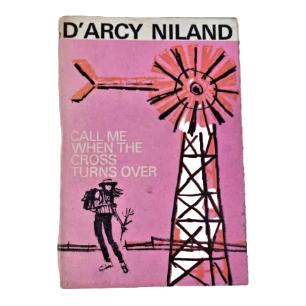 The cover of a vintage fiction book titled "Call Me When The Cross Turns Over." The cover artwork displays a windmill with a woman standing near, on a bright pink background.